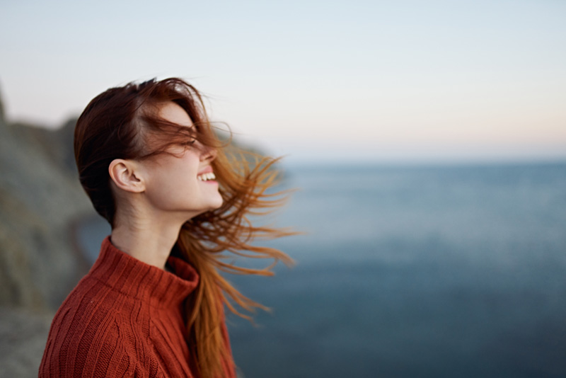 woman looking off to the side with a slight smile